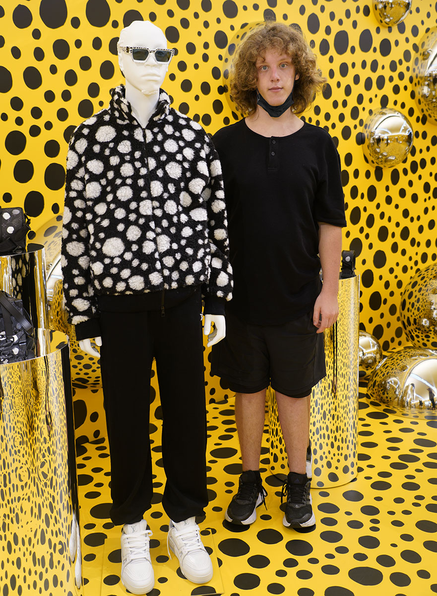 Emerging artist, Shawn Sebastian Prickett, tries out the Kusama inspired Luis Vuitton presentation at Marina Sands